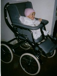 Photo of Emma in Babyhood stroller with handle folded back.