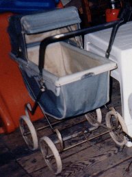 Photo of blue doll carriage.